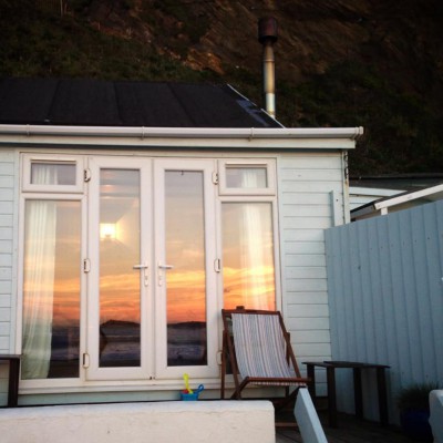 Sunset reflections at Lusty Glaze, a dog friendly beach