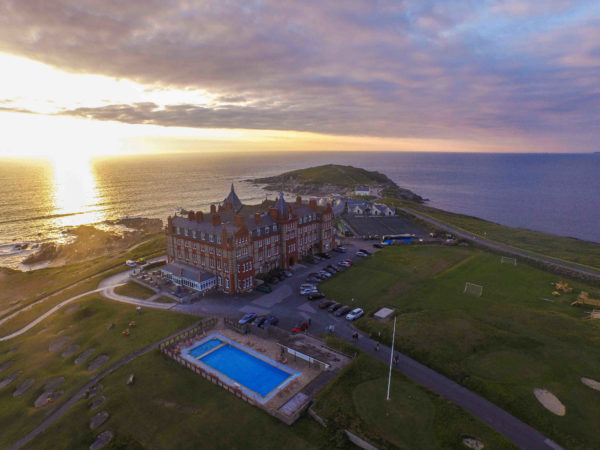 The Headland Hotel from the sky at sunset