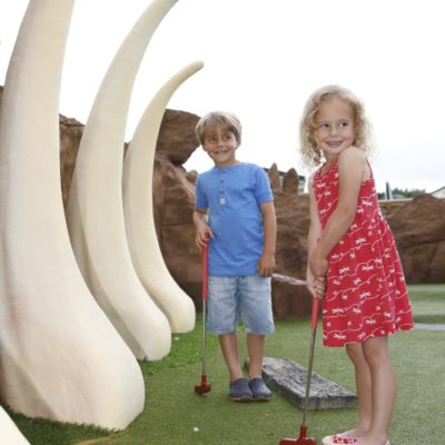 Children playing crazy golf at Ladram Bay Holiday Park