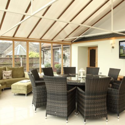 Round dining table in a conservatory