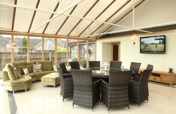Round dining table in a conservatory